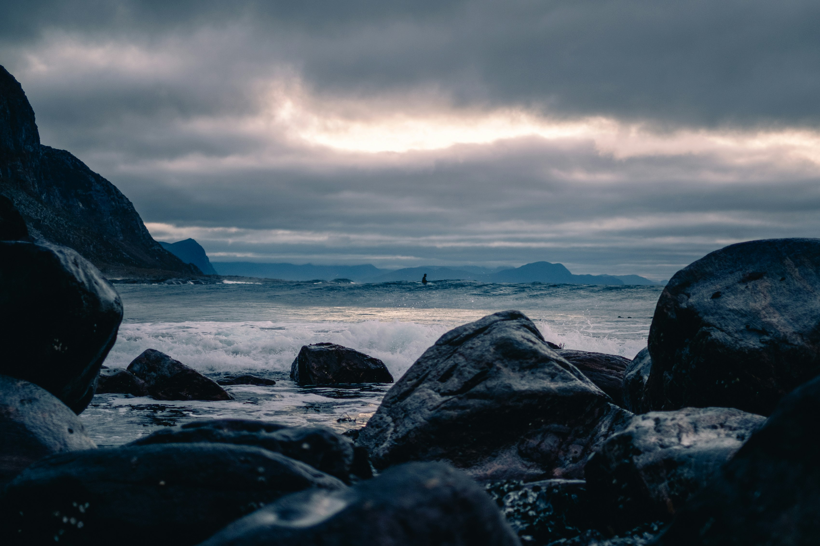 sea waves crashing towards rocks